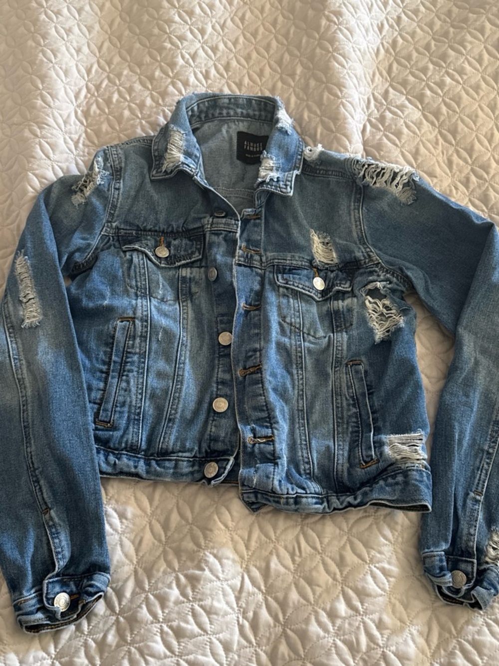 Distressed denim jacket